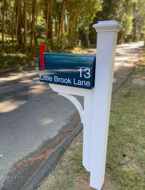 Blue mailbox with custom address lettering mounted on a handcrafted white post in Newtown, Connecticut.