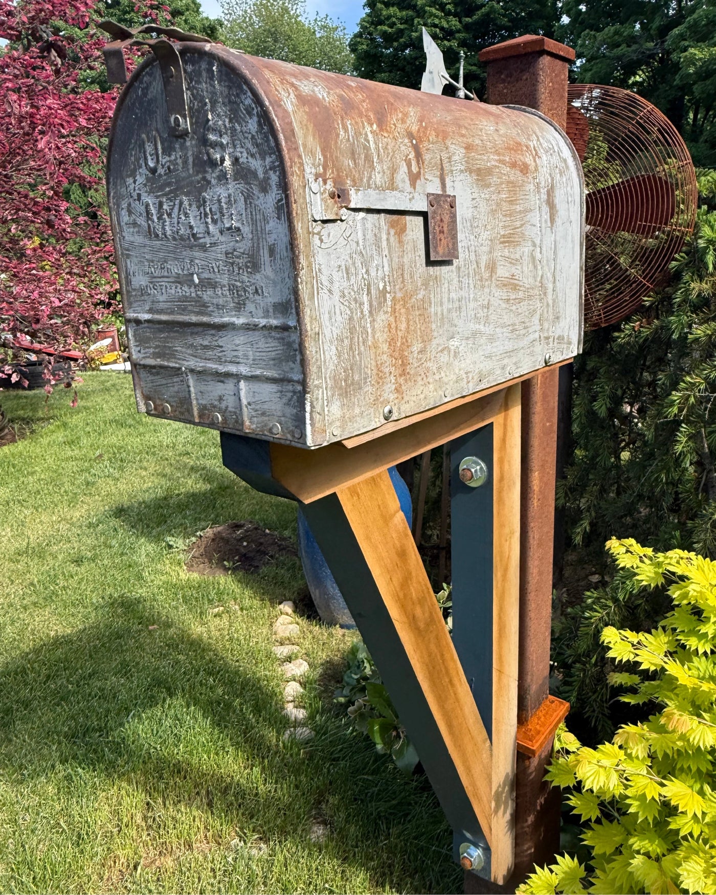 Front angled view of a rustic XL mailbox set featuring weathered metal textures, cedar support structure, and reinforced steel construction.