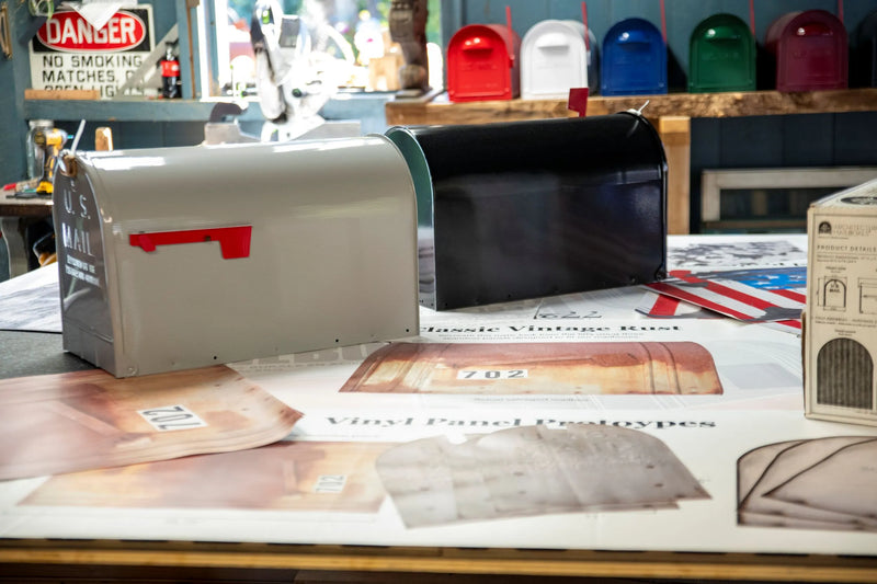 Mailbox prototypes and design samples displayed during product development.