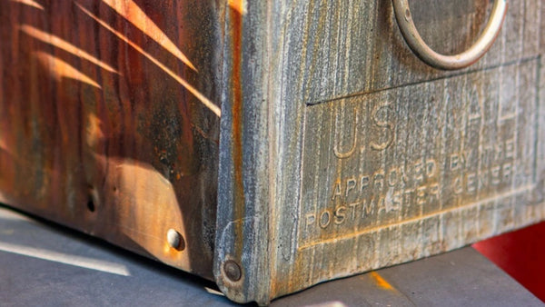 Weathered metal surface developing a natural patina over time.