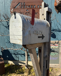 Full angled view of a rustic vintage mailbox set featuring reclaimed barn beam construction, steel reinforcement, and handcrafted cedar detailing.