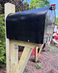 Front angled view of a handcrafted black XL mailbox set with pressure-treated wood construction and modern farmhouse styling.