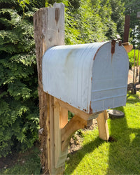 Rear angled view of a vintage-style XL mailbox with handcrafted cedar bracket and natural rustic wood post.