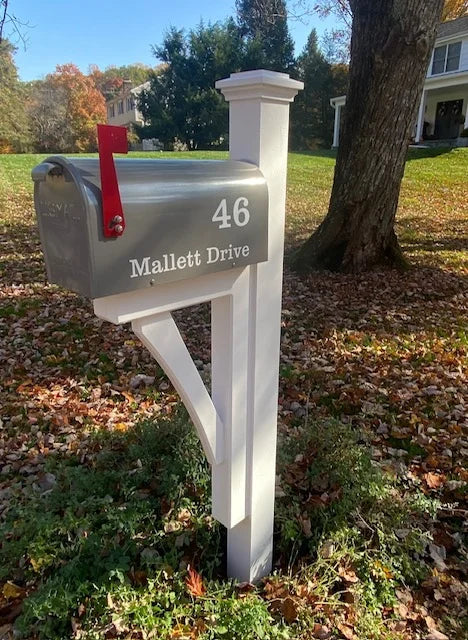 Gray mailbox with custom address lettering mounted on a handcrafted white post in Trumbull, Connecticut.